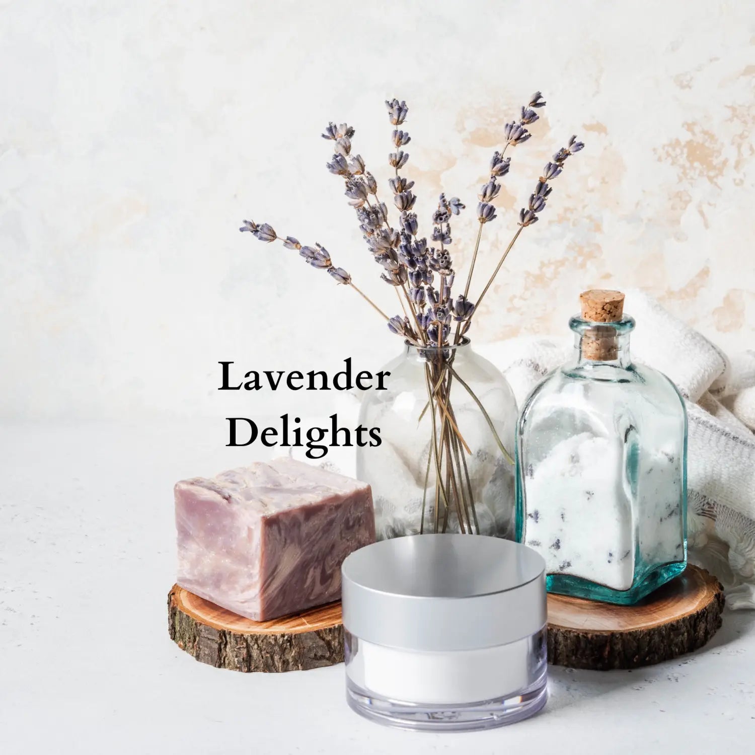 'lavender delights' picture of soap, cosmetic cream, jar of sugar, and a small vase holding a few sprigs of lavender flower spikes