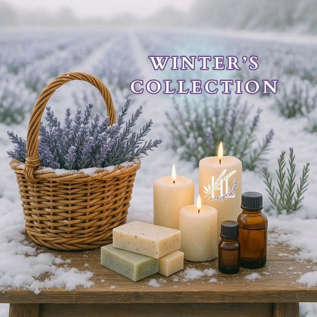 Homestead Lavender Farm | Winter's Collection Photo, lavender field covered with snow and a wooden table covered with a basket filled with lavender, lit candles are on the table and soaps and essential oils are present