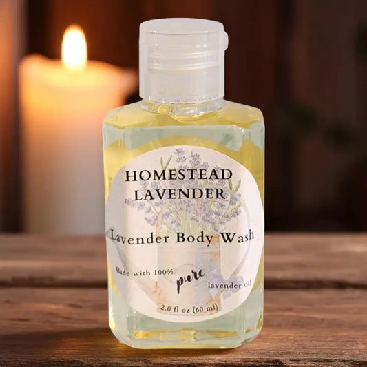 Homestead Lavender body wash bottle with a candle in the background